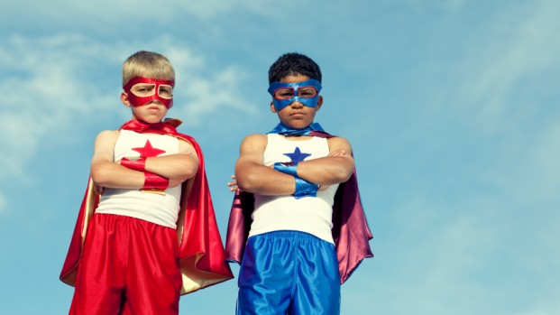 Two kids dressed as superheroes